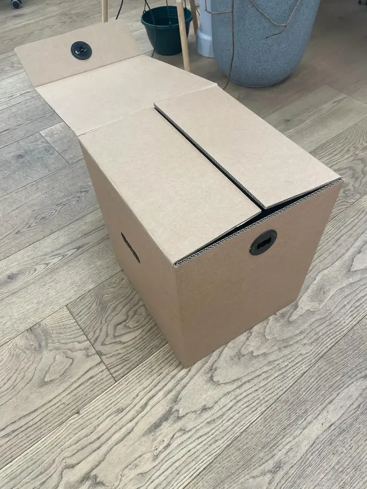Final box, closed, with carry handle cut-outs