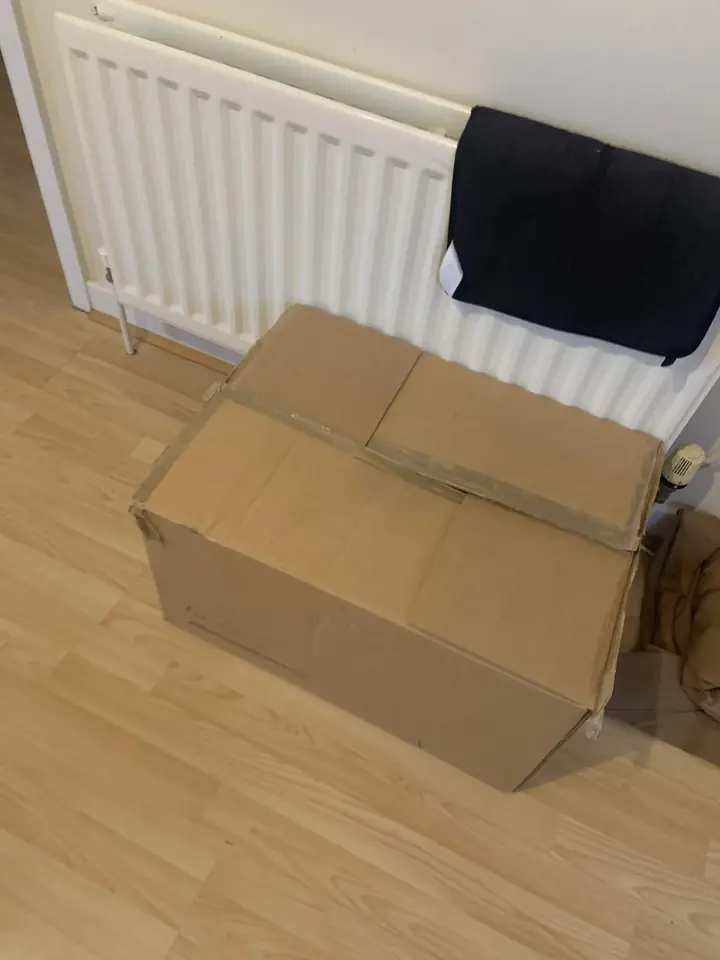 The original packaging: a large taped cardboard box