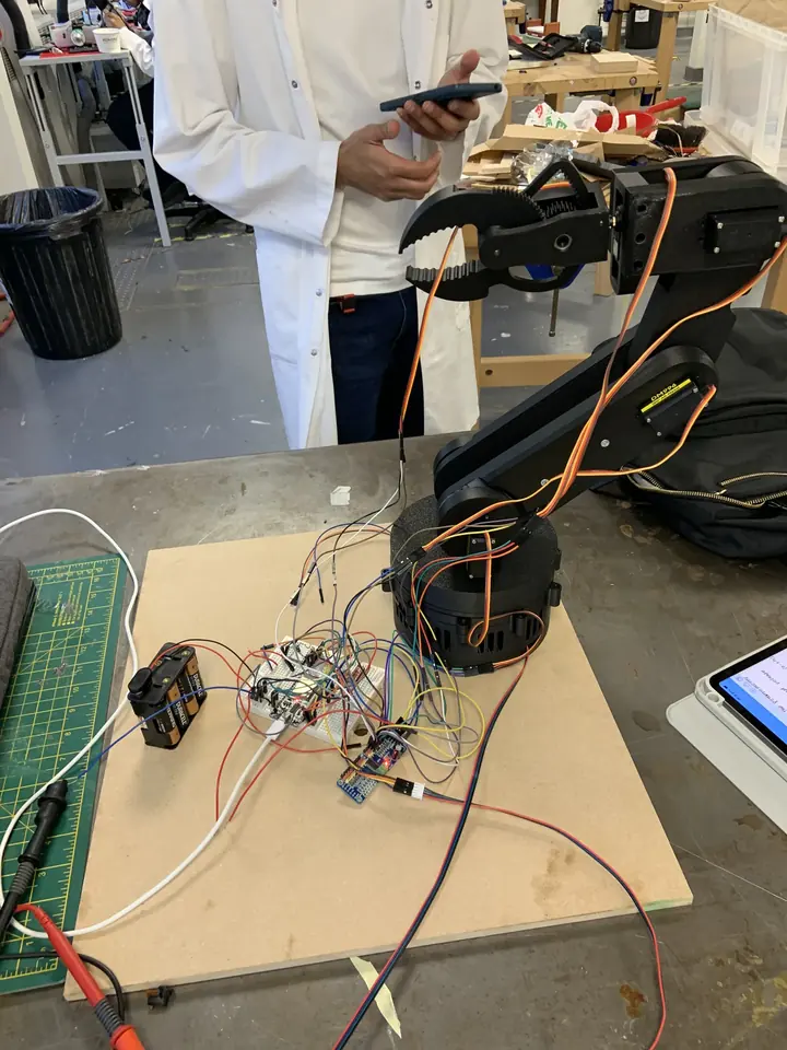 Arm mounted on a test board with control electronics