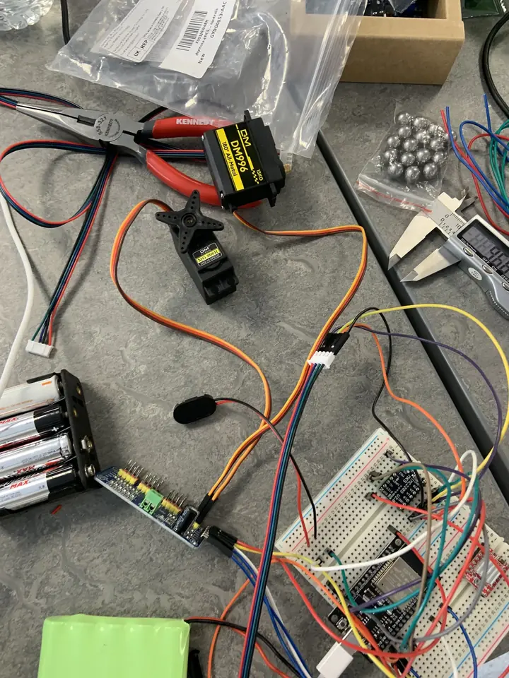 Servos and driver board laid out for testing