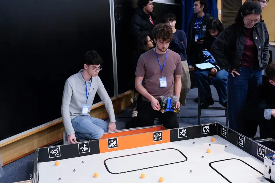 Team running the robot on the competition arena