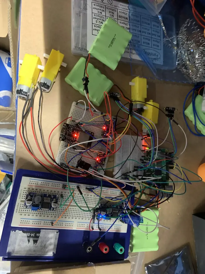 Electronics prototyped on a breadboard with motors and batteries