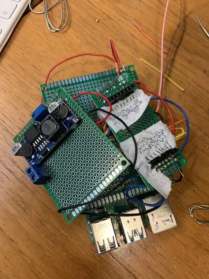 Stacked perfboard with Raspberry Pi and power regulation