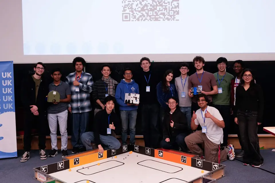 The Imperial Unibots team with the other competitors around the arena